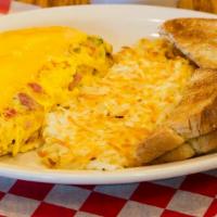 Corner Omelette · Ham, mushrooms, onions, sweet peppers, tomatoes and American cheese