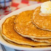Short Stack · Three of our buttermilk pancakes served with maple syrup and whipped butter
