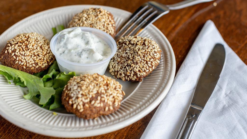 Falafel · Gluten Sensitive, Vegetarian. Vegan. Freshly Ground Chickpeas Perfectly Blended with Parsley & Seasoned with Our Secret Spices, Fried Until Golden On The Outside & Served with Creamy Yogurt Sauce.