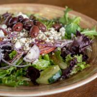 Greek Salad · Gluten Sensibilities. Vegetarian. Mixed Greens, Tomatoes, Cucumbers, & Red Onions, Topped wi...