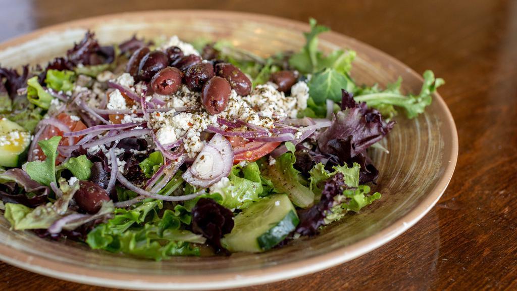 Greek Salad · Gluten Sensibilities. Vegetarian. Mixed Greens, Tomatoes, Cucumbers, & Red Onions, Topped with Feta Cheese & Served Wit Kalamata Olives, Drizzled with Our House Dressing.