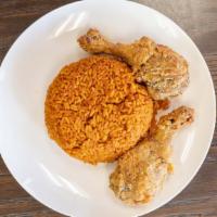 Jollof Rice & Chicken · Jollof rice is a one-pot rice dish consisting of fried and stewed tomatoes as its flavor bas...