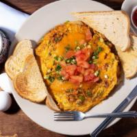 Tex Mex Scrambler · Three eggs, peppers, onions, fried potatoes, bacon, chorizo.