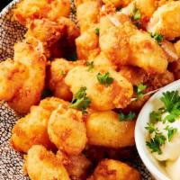 Cheese Curds · Vegetarian. Crispy fried Wisconsin white cheddar cheese curds, served with charred onion dip