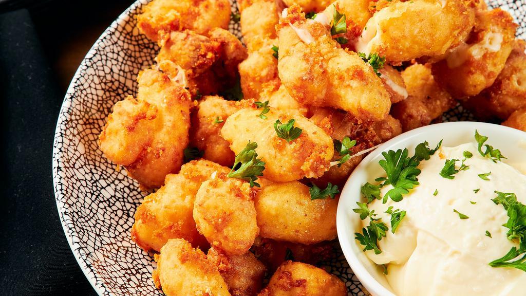 Cheese Curds · Vegetarian. Crispy fried Wisconsin white cheddar cheese curds, served with charred onion dip