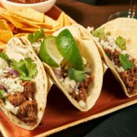 Steak Tacos · marinated beef tenderloin tips, chopped
onion, avocado-tomatillo salsa, queso
fresco, tortil...