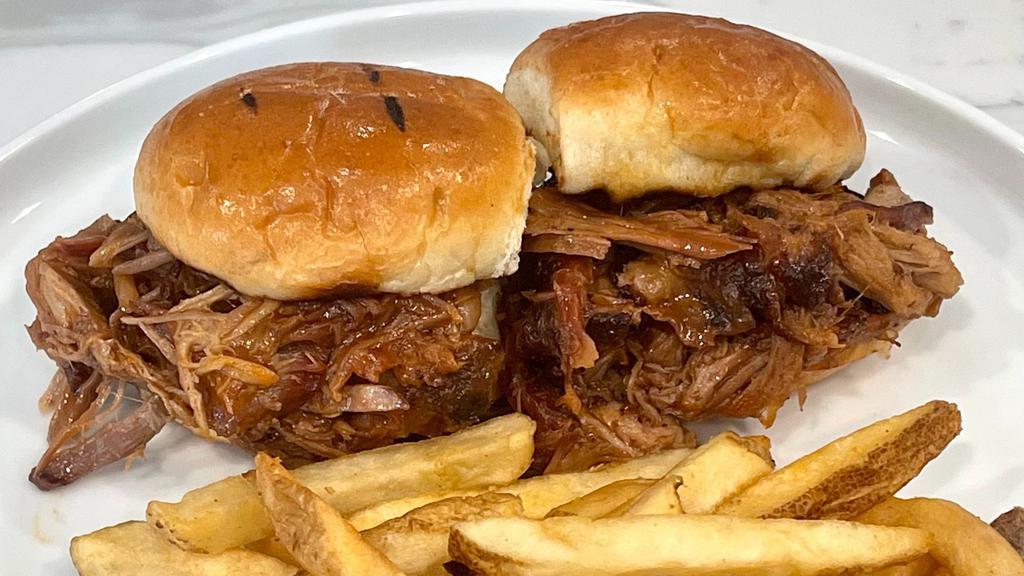 Kid'S Pulled Pork Sliders (2) · Tossed in texas mop sauce and served with seasoned fries.