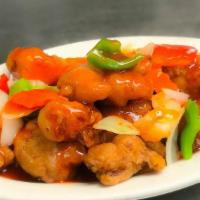 Sweet & Sour Chicken · Classic fried chicken coated in sweet & sour sauce, garnished with sweet bell peppers & pine...
