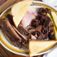 Platter For Two · A combination  of sliced brisket, ham, burnt ends, and our tender ribs grilled Texas toast.