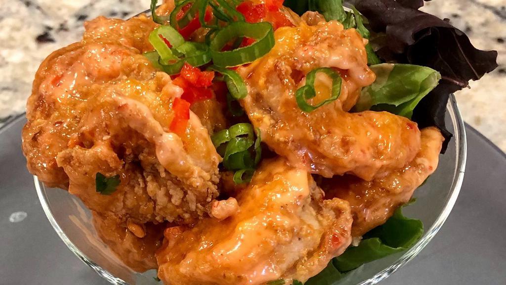 Dynamite Shrimp · Crispy fried shrimp coated in sweet chili and sriracha sauce.