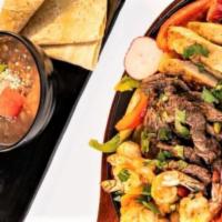 Fajitas · Serves up to 2 people. All fajitas are cooked with grilled onion, bell peppers, cilantro ser...