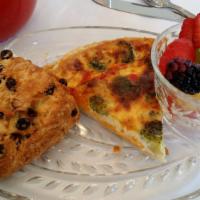 Quiche Du Jour · With Fresh Fruit and two Slices Tea Bread.