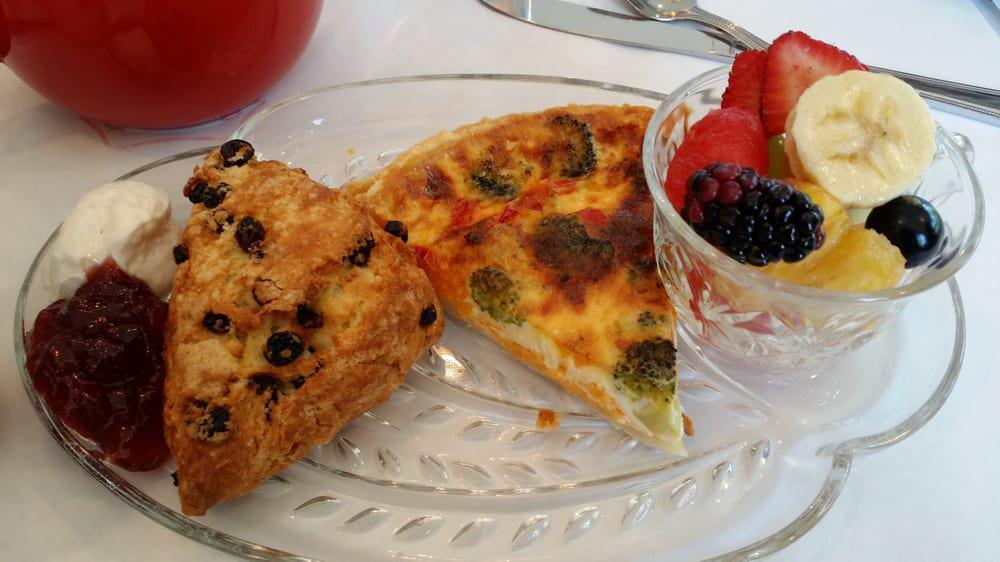 Quiche Du Jour · With Fresh Fruit and two Slices Tea Bread.