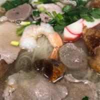 Combination Pho · Shrimp, imitation crab, rare steak well done, meatballs, and pork belly.