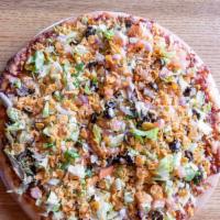 Taco Pizza · Ground beef topped with lettuce, tomato, onion, black olive, Doritos, nacho cheese and serve...