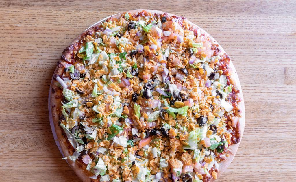 Taco Pizza · Ground beef topped with lettuce, tomato, onion, black olive, Doritos, nacho cheese and served with sour cream.