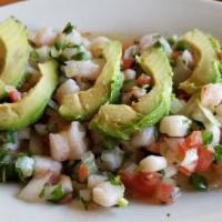 Ceviche · Chopped shrimp with onions, tomatoes, jalapeño, cilantro, and lime juice. Served with cracke...