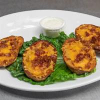 Potato Skins · Filled with crispy bacon and melted cheddar.