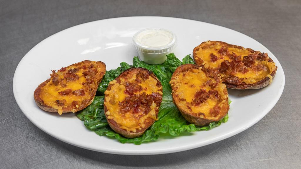 Potato Skins · Filled with crispy bacon and melted cheddar.