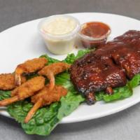 1/2 Slab Rib & Shrimp Combo · Served with garlic bread french fries spaghetti and choice of sides.
