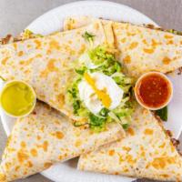 Quesadillas · Chicken, steak or ground beef. Served with lettuce, tomato, mozzarella cheese and sour cream...
