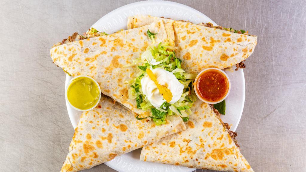 Quesadillas · Chicken, steak or ground beef. Served with lettuce, tomato, mozzarella cheese and sour cream. Pork - pastor for an extra cost.