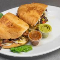 Tortas · Chicken, steak or ground beef. Served with lettuce, tomato, cheese, beans and sour cream. Po...
