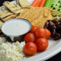 Hummus Appetizer · House-made hummus, topped with olive oil and served with celery, carrots, cucumbers, cherry ...