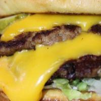Smash Burger · Two thin seared patties, topped with American cheese, shredded lettuce, tomato, pickles, oni...
