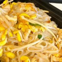 Pad Thai Noodles · Rice noodles, eggs, green onions, and bean sprouts, topped with crushed peanuts and lemon.