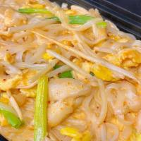 Curry Noodle · Rice noodles, eggs, green onions, bean sprouts, red curry and coconut milk. (Mild Spice)