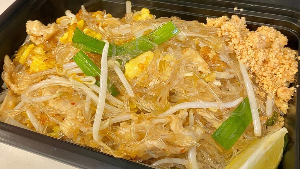 Pad Thai Woon Sen · Vermicelli transparent noodle with eggs, green onions, beansprouts, topped with crushed peanut and lemon.
