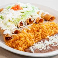 6 Tacos Dorados · Services with lettuce, sour cream and cheese on top. Rice and beans on the side