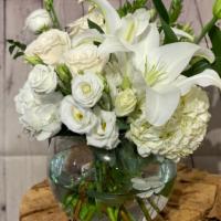 Halcyon Heart · Lilies, roses, lisianthus, and more - all shades of creamy white - are elegantly arranged in...