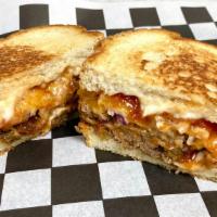 Midtown Meatloaf · Better than your mama's meatloaf!
With cheddar, mayo, onion, grilled on white bread.