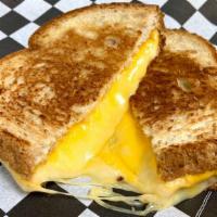 Grilled Cheese · Cheddar, American, Swiss, & Provolone grilled on wheat bread.