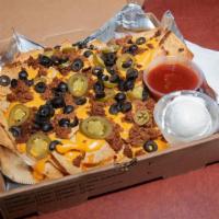Nachos · Tortilla chips topped with seasoned ground beef, nacho cheese, jalapeno peppers and black ol...