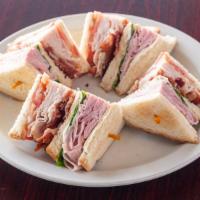Club Sandwich · Triple decker turkey, ham, bacon and Swiss cheese.