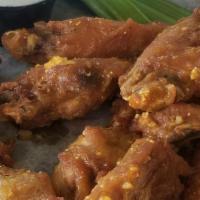Chicken Wings · Ten jumbo wings tossed in your choice of sauce.  Please choose smoked ranch or chunky blue c...