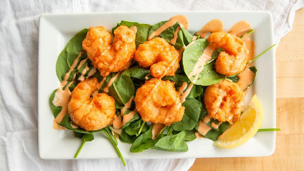 Shakers Bangin' Shrimp · Beer battered & drizzled with Shakers sauce, over baby spinach.