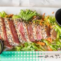 Sesame Seared Ahi Tuna · Spring Greens, Rice Noodles, Ponzu soy sauce, served with wasabi.