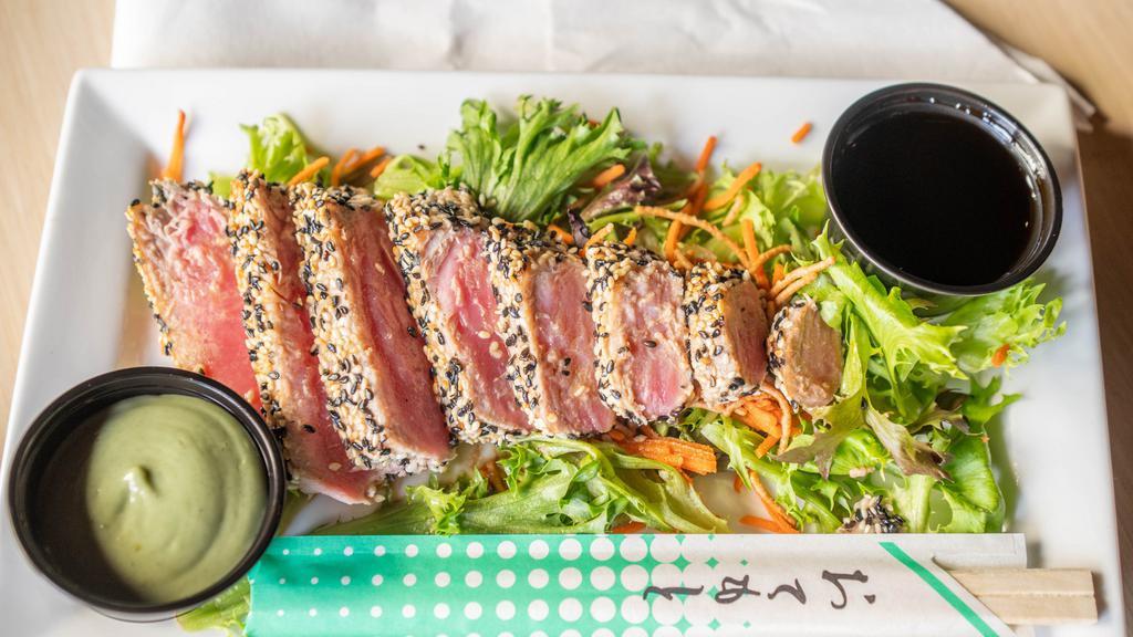 Sesame Seared Ahi Tuna · Spring Greens, Rice Noodles, Ponzu soy sauce, served with wasabi.