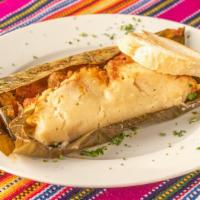 Tamal Guatemalteco Y Salvadoreño Guatemalan & Salvadorian Tamale · Corn tamale stuffed with pork, olives, red peppers steamed in banana leaf served with bread ...