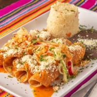 Tacos Guatemaltecos · Four taquitos filled with your choice of chicken, beef or potato, served with rice and black...