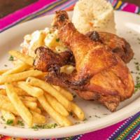 Pollo Frito · Fried chicken, served with rice salad and french fries.