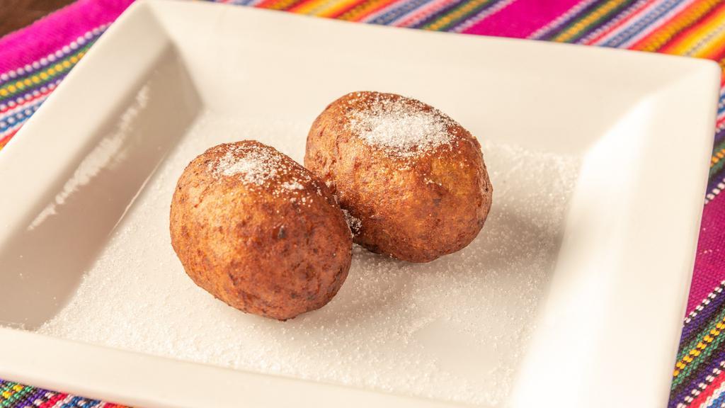 Rellenitos · Made with fried sweet plantain dough stuffed with sweet chocolate and black beans or sweet monjor blanco milk delicacy.