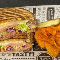Not Your Father’S Reuben Panini  · Naturally Cured Corned Beef, Provolone Cheese, 1000 Island Dressing, Slaw on Marble Rye.