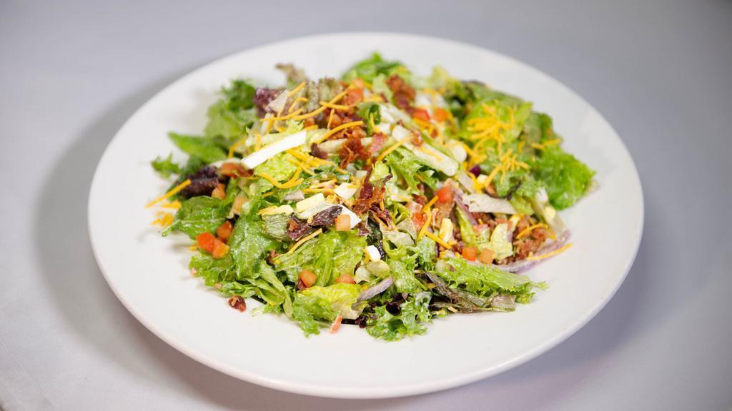 Chicken Ford'S Chop-Shop Salad · Chopped mixed greens with grilled chicken,cucumber, vine ripe tomatoes, red onion, shredded cheddar cheese, hard boiled egg, chick peas, and bacon, tossed in ranch dressing.