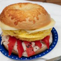 Asiago Omelet · Scrambled egg, roasted red pepper, turkey, Asiago cheese on an Asiago bagel.