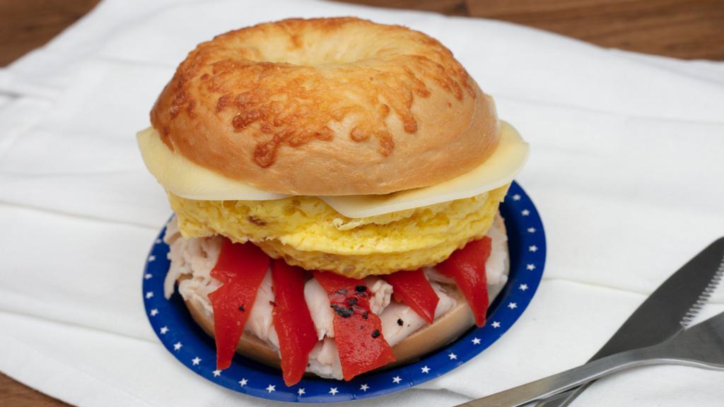 Asiago Omelette · Scrambled egg, roasted red pepper, turkey, asiago cheese on an asiago bagel.